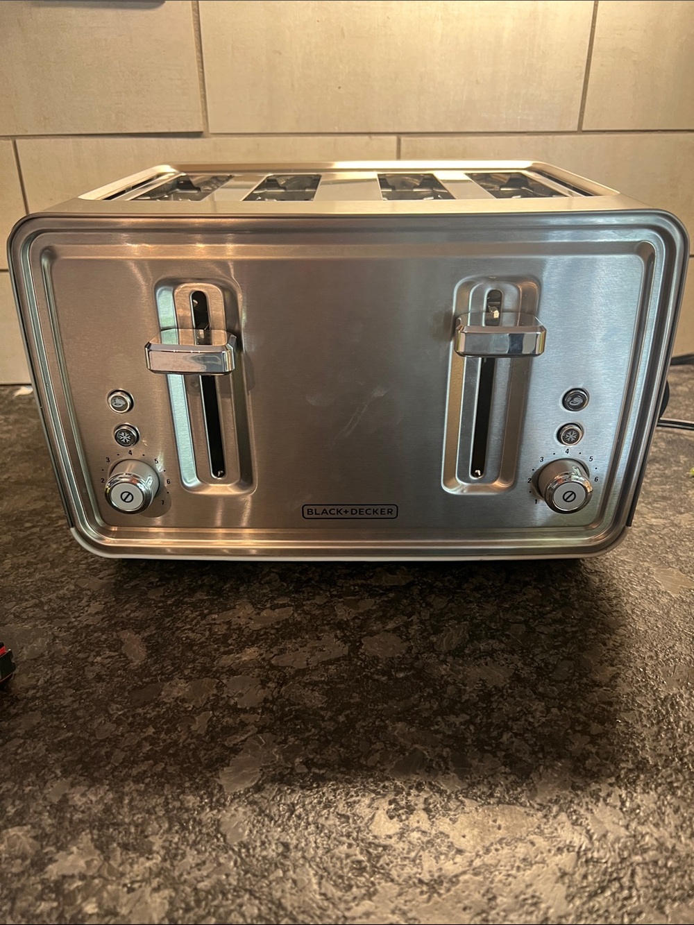 Wide 4 Slot Black and Decker Stainless toaster. Like new.